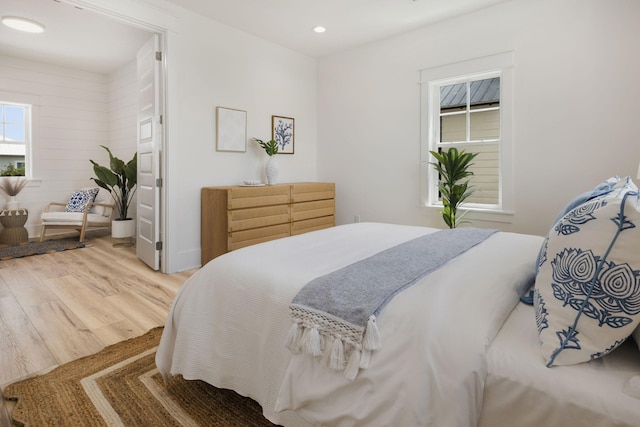 bedroom featuring recessed lighting and wood finished floors