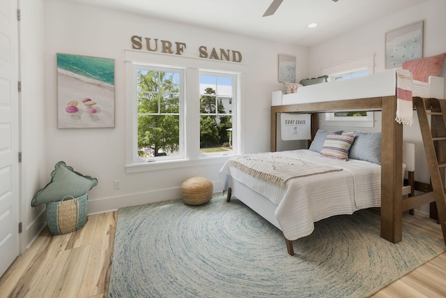 bedroom featuring baseboards, recessed lighting, a ceiling fan, and wood finished floors