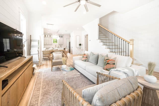 174 Grande Pointe Cir, Inlet Beach, FL 32461 - living room with light wood-style floors, ceiling fan, and stairway