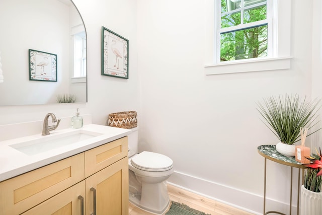 174 Grande Pointe Cir, Inlet Beach, FL 32461 - half bath featuring plenty of natural light, vanity, and wood finished floors