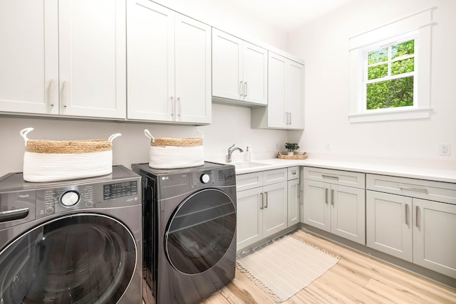 174 Grande Pointe Cir, Inlet Beach, FL 32461 - washroom featuring cabinet space, washing machine and clothes dryer, and light wood-type flooring
