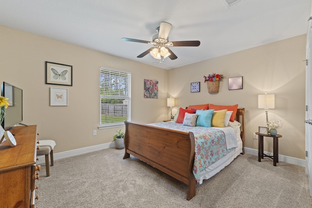 carpeted bedroom featuring baseboards and ceiling fan