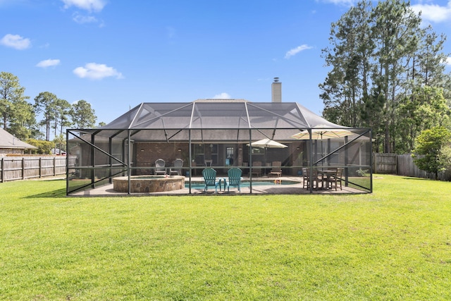 rear view of house with a fenced backyard, a fenced in pool, a chimney, and a patio