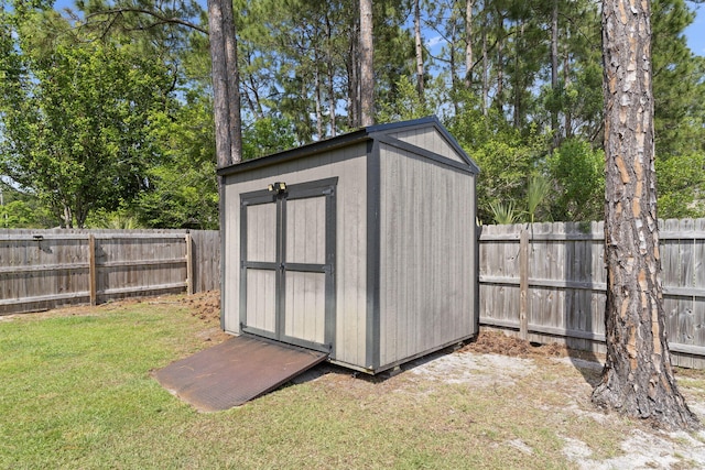 view of shed featuring a fenced backyard