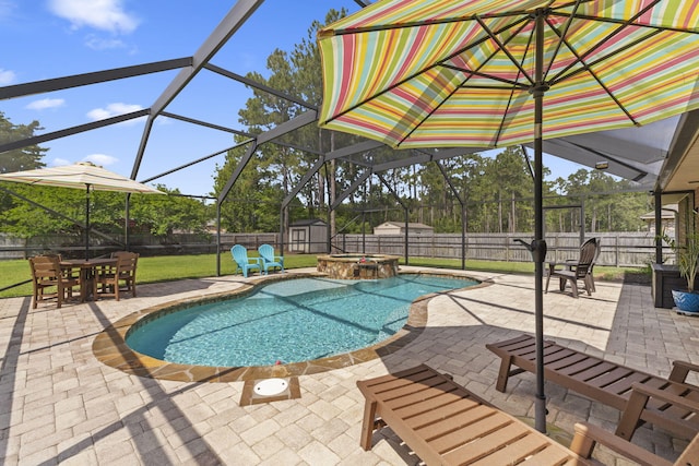 view of swimming pool with a patio, a fenced backyard, and a storage shed