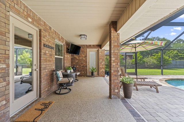 view of patio / terrace with a lanai and an outdoor pool