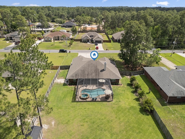 aerial view with a residential view and a view of trees