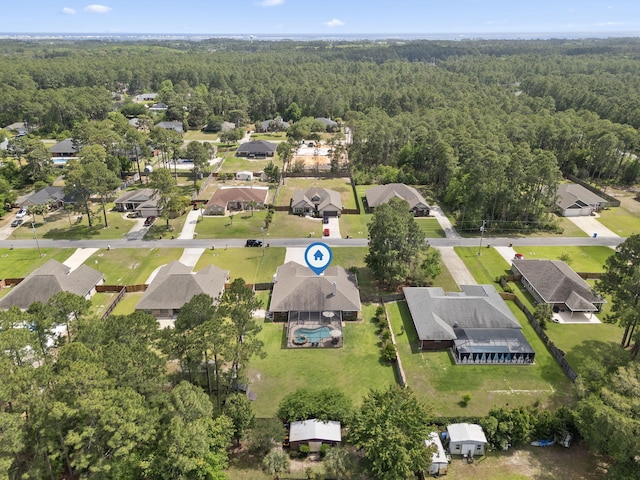 aerial view featuring a residential view and a forest view