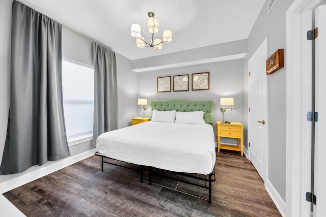 10519 Front Beach Rd Unit 1802B, Panama City Beach, FL 32407 - bedroom with baseboards, a notable chandelier, wood finished floors, and visible vents