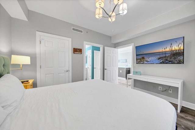 10519 Front Beach Rd Unit 1802B, Panama City Beach, FL 32407 - bedroom with a notable chandelier, baseboards, visible vents, and wood finished floors