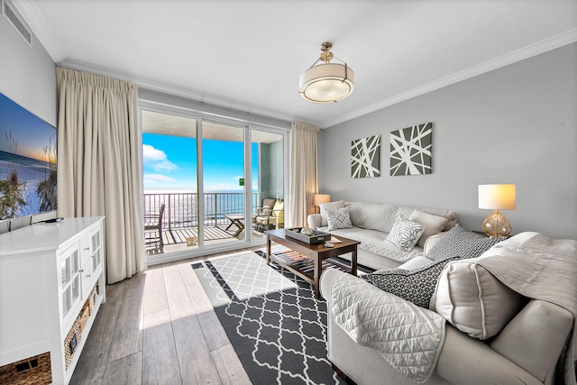 10519 Front Beach Rd Unit 1802B, Panama City Beach, FL 32407 - living area featuring visible vents, ornamental molding, and hardwood / wood-style floors
