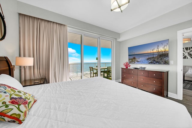 10519 Front Beach Rd Unit 1802B, Panama City Beach, FL 32407 - bedroom featuring access to outside, baseboards, and wood finished floors