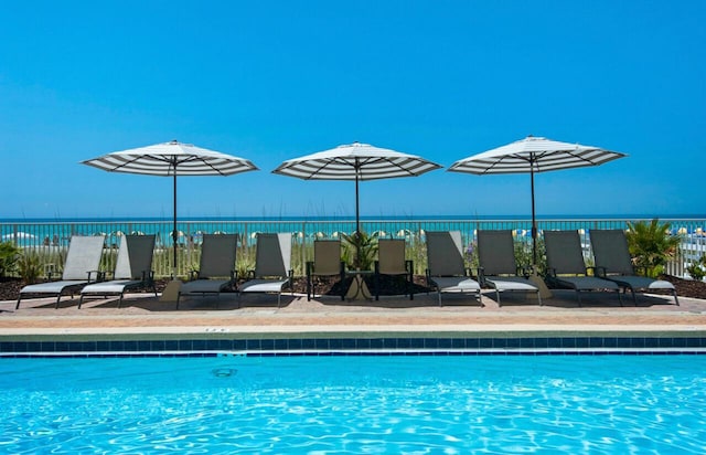 10519 Front Beach Rd Unit 1802B, Panama City Beach, FL 32407 - community pool featuring a water view and fence