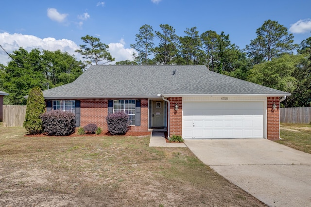 ranch-style home featuring fence, a shingled roof, brick siding, a garage, and driveway