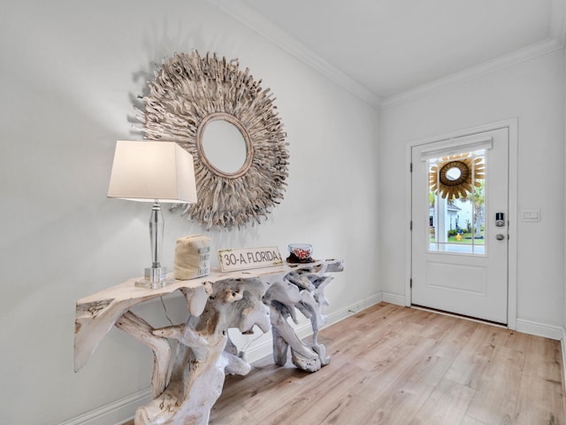 183 Pine Lake Dr, Santa Rosa Beach, FL 32459 - entrance foyer with baseboards, ornamental molding, and wood finished floors