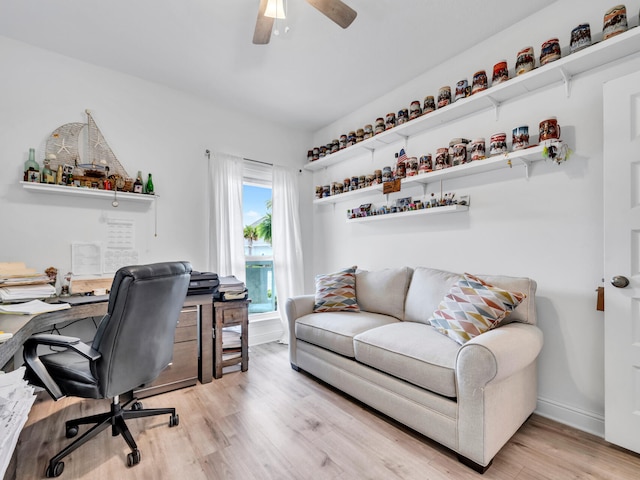 183 Pine Lake Dr, Santa Rosa Beach, FL 32459 - home office featuring a ceiling fan, baseboards, and light wood-style floors