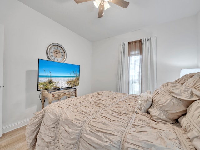 183 Pine Lake Dr, Santa Rosa Beach, FL 32459 - bedroom with baseboards, ceiling fan, vaulted ceiling, and light wood-type flooring