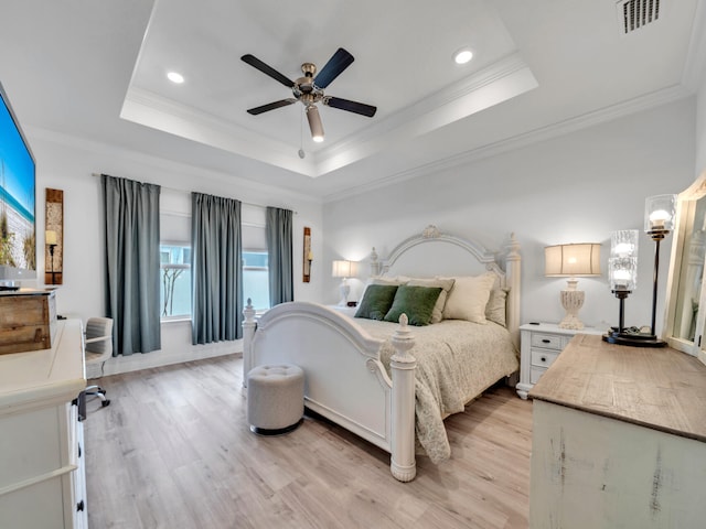 183 Pine Lake Dr, Santa Rosa Beach, FL 32459 - bedroom with a tray ceiling, visible vents, ornamental molding, and light wood finished floors