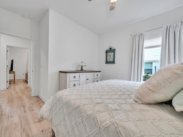 183 Pine Lake Dr, Santa Rosa Beach, FL 32459 - bedroom with a ceiling fan, baseboards, and light wood-style floors