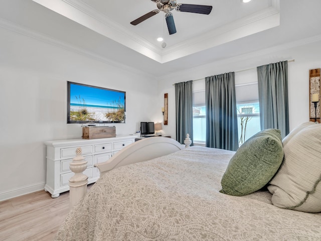 183 Pine Lake Dr, Santa Rosa Beach, FL 32459 - bedroom featuring crown molding, baseboards, recessed lighting, a tray ceiling, and light wood-style flooring