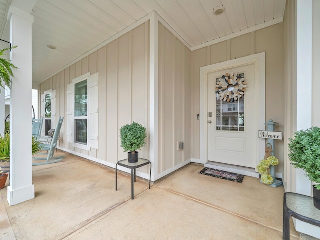183 Pine Lake Dr, Santa Rosa Beach, FL 32459 - property entrance with a porch and board and batten siding