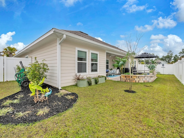183 Pine Lake Dr, Santa Rosa Beach, FL 32459 - rear view of property featuring ceiling fan, a patio, a fenced backyard, a fenced in pool, and a lawn