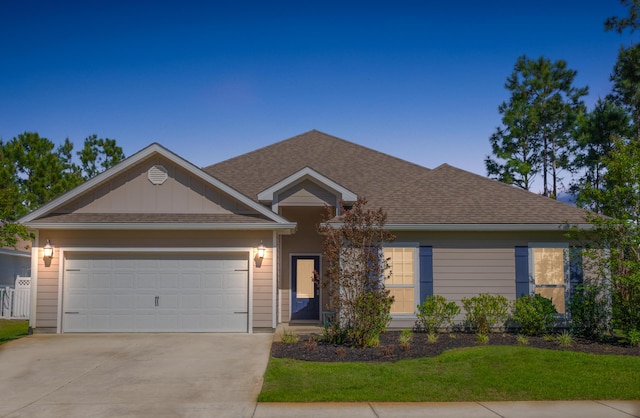 672 Alderberry Rd, Santa Rosa Beach, FL 32459 - ranch-style house featuring roof with shingles, driveway, a front yard, and a garage
