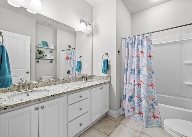 672 Alderberry Rd, Santa Rosa Beach, FL 32459 - full bathroom featuring tile patterned flooring, a sink, double vanity, and toilet