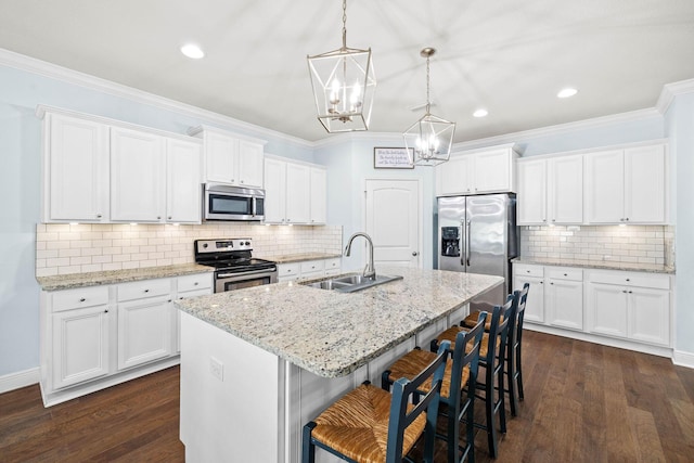 672 Alderberry Rd, Santa Rosa Beach, FL 32459 - kitchen featuring decorative backsplash, an island with sink, a chandelier, a sink, and appliances with stainless steel finishes