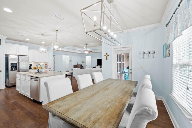 672 Alderberry Rd, Santa Rosa Beach, FL 32459 - dining room with ornamental molding, ceiling fan with notable chandelier, recessed lighting, visible vents, and dark wood-style floors
