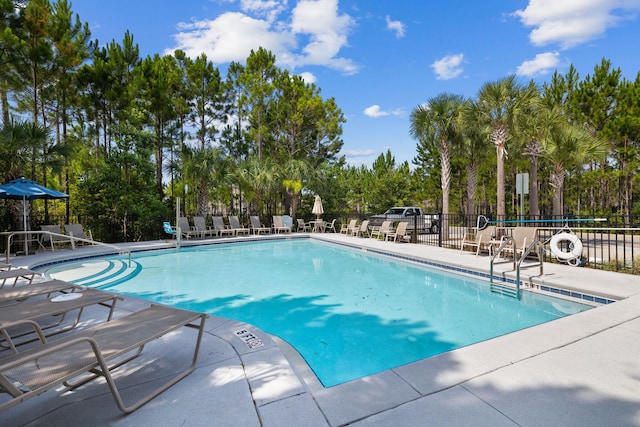 672 Alderberry Rd, Santa Rosa Beach, FL 32459 - community pool featuring a patio and fence