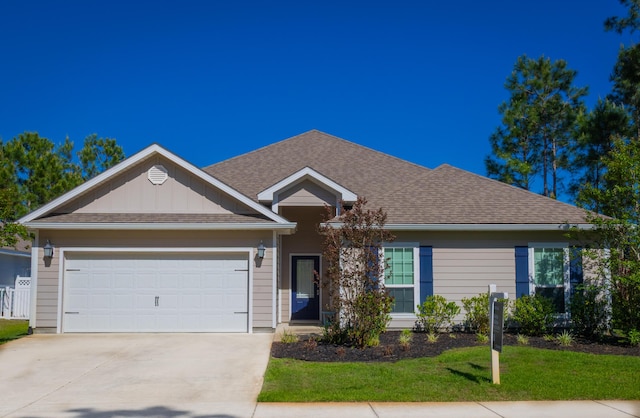 672 Alderberry Rd, Santa Rosa Beach, FL 32459 - ranch-style house featuring a shingled roof, an attached garage, a front lawn, board and batten siding, and driveway