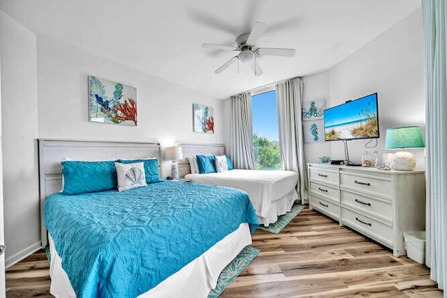 bedroom featuring a ceiling fan and light wood-style floors