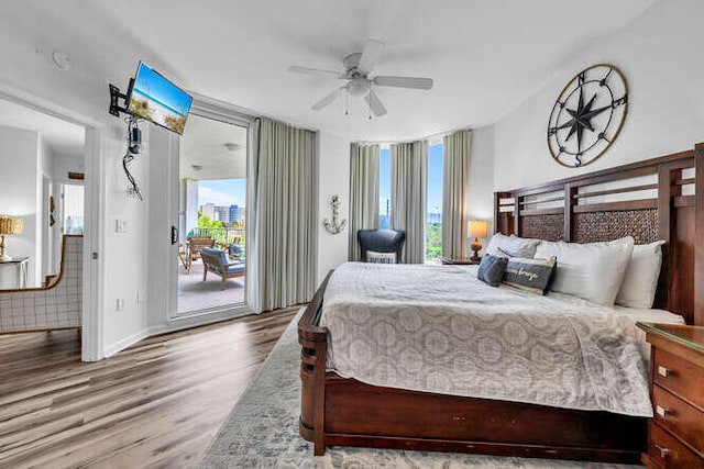bedroom with access to outside, a ceiling fan, baseboards, and wood finished floors
