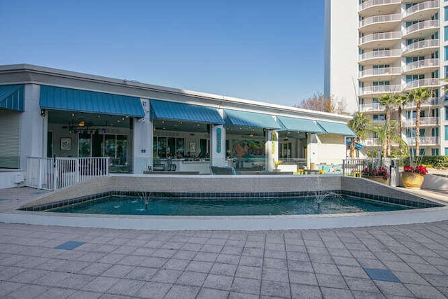 outdoor pool with a patio