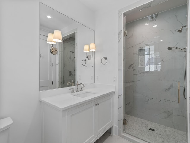 full bath with vanity, toilet, a marble finish shower, marble finish floor, and recessed lighting