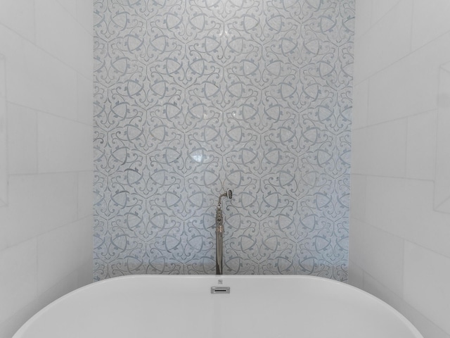 full bath featuring a freestanding tub