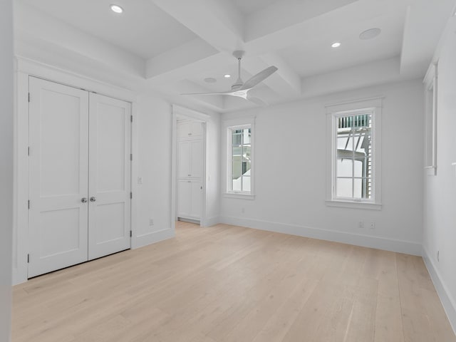 unfurnished bedroom with beamed ceiling, light wood-style floors, baseboards, recessed lighting, and coffered ceiling