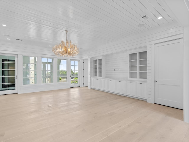 unfurnished sunroom with visible vents and a chandelier