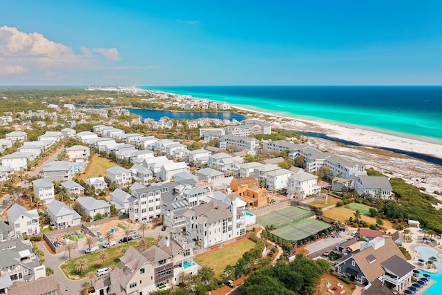 birds eye view of property with a beach view, a residential view, and a water view