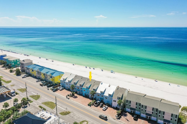 birds eye view of property featuring a view of the beach and a water view