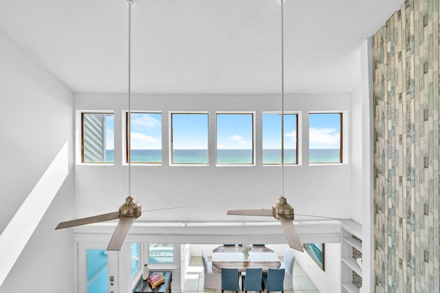details with a water view and ceiling fan