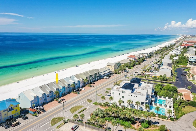 drone / aerial view with a water view and a view of the beach