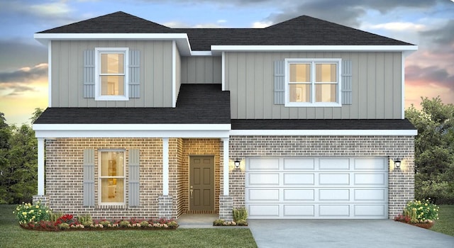 3068 Heritage Plantation Blvd, Laurel Hill, FL 32567 - view of front facade with board and batten siding, brick siding, concrete driveway, an attached garage, and a shingled roof