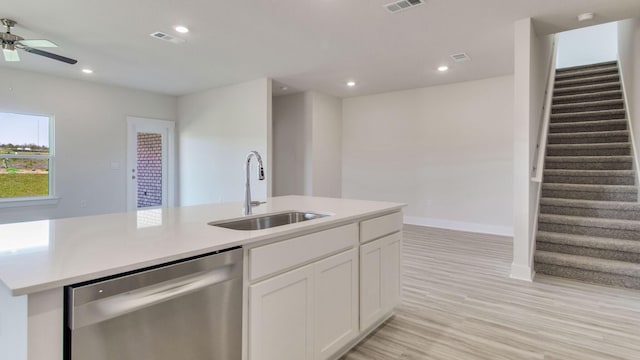 3068 Heritage Plantation Blvd, Laurel Hill, FL 32567 - kitchen featuring stainless steel dishwasher, ceiling fan, light countertops, white cabinetry, and a sink