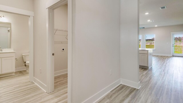 3068 Heritage Plantation Blvd, Laurel Hill, FL 32567 - hallway featuring light wood-style floors, baseboards, recessed lighting, and visible vents