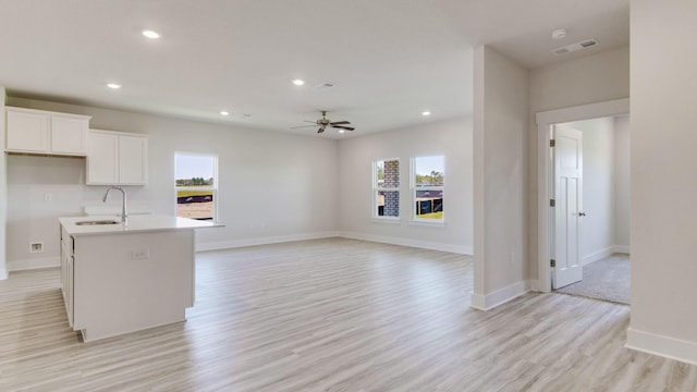 3068 Heritage Plantation Blvd, Laurel Hill, FL 32567 - kitchen featuring visible vents, a sink, light wood finished floors, and a healthy amount of sunlight