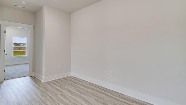 3068 Heritage Plantation Blvd, Laurel Hill, FL 32567 - empty room with light wood-style floors, baseboards, and visible vents