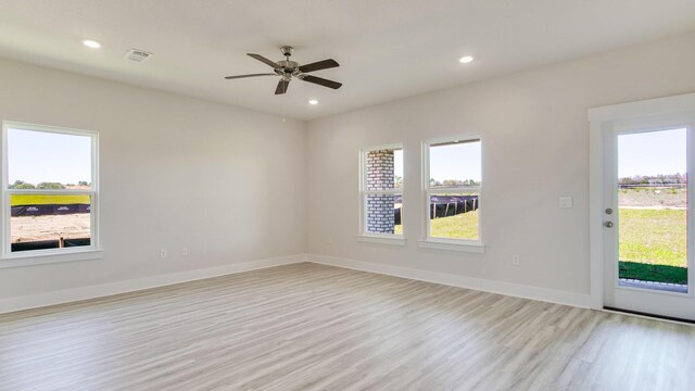 3068 Heritage Plantation Blvd, Laurel Hill, FL 32567 - empty room with baseboards, visible vents, a wealth of natural light, and light wood-type flooring