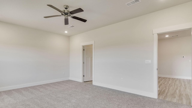 3068 Heritage Plantation Blvd, Laurel Hill, FL 32567 - unfurnished room with visible vents, a ceiling fan, baseboards, and light colored carpet